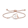 Thumbnail Image 0 of 0.088 CT. T.W. Diamond Interlocking Double Elongated Heart Bolo Bracelet in Sterling Silver with 14K Rose Gold Plate