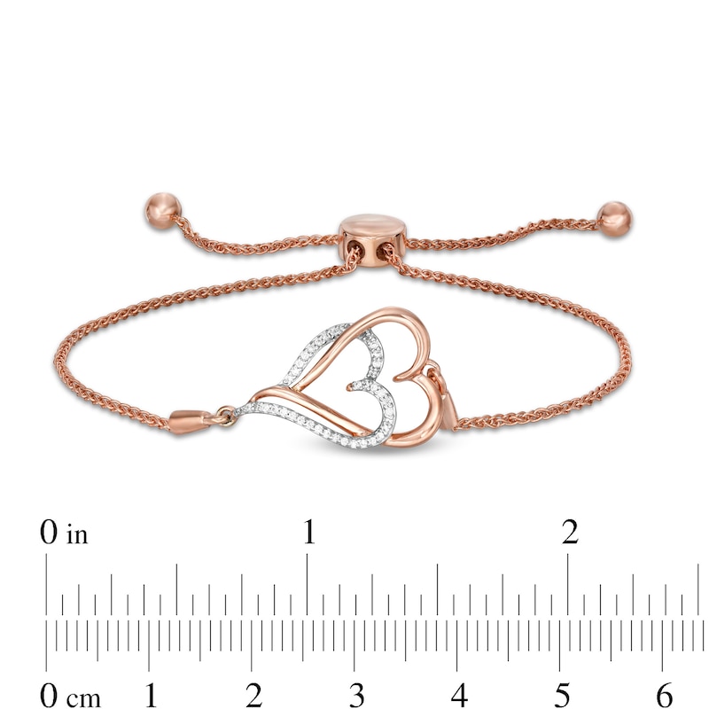0.088 CT. T.W. Diamond Interlocking Double Elongated Heart Bolo Bracelet in Sterling Silver with 14K Rose Gold Plate