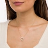 Thumbnail Image 1 of 0.18 CT. T.W. Diamond Elongated Heart Sunburst Pendant in 10K Gold