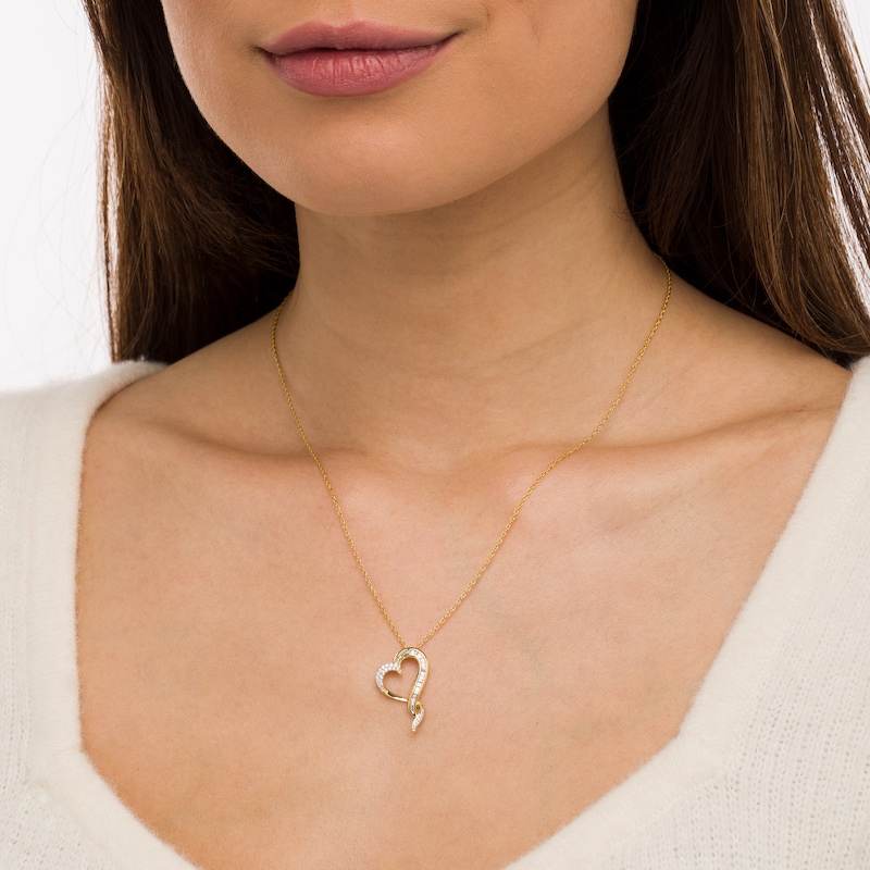 0.145 CT. T.W. Baguette and Round Diamond Twist Heart Pendant in 10K Gold|Peoples Jewellers
