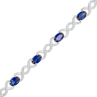 Oval Lab-Created Sapphire and 0.18 CT. T.W. Diamond Infinity Ribbon Link Line Bracelet in Sterling Silver – 7.5