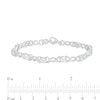 Oval Lab-Created Sapphire and 0.18 CT. T.W. Diamond Infinity Ribbon Link Line Bracelet in Sterling Silver – 7.5