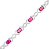 Thumbnail Image 0 of Oval Lab-Created Ruby and 0.18 CT. T.W. Diamond Infinity Ribbon Link Line Bracelet in Sterling Silver – 7.5"