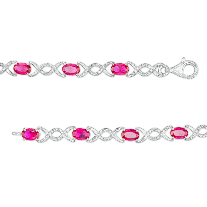 Oval Lab-Created Ruby and 0.18 CT. T.W. Diamond Infinity Ribbon Link Line Bracelet in Sterling Silver – 7.5"
