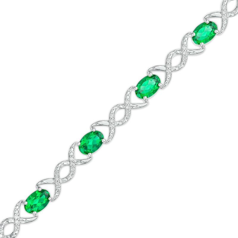 Oval Lab-Created Emerald and 0.18 CT. T.W. Diamond Infinity Ribbon Link Line Bracelet in Sterling Silver – 7.5"|Peoples Jewellers