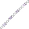 Thumbnail Image 0 of Oval Lab-Created Alexandrite and 0.18 CT. T.W. Diamond Infinity Ribbon Link Line Bracelet in Sterling Silver – 7.5"