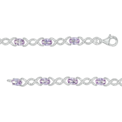 Oval Lab-Created Alexandrite and 0.18 CT. T.W. Diamond Infinity Ribbon Link Line Bracelet in Sterling Silver – 7.5"