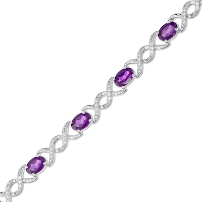 Oval Amethyst and 0.18 CT. T.W. Diamond Infinity Ribbon Link Line Bracelet in Sterling Silver – 7.5"