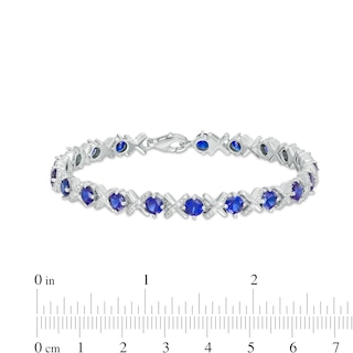 4.5mm Blue Lab-Created Sapphire and 0.14 CT. T.W. Diamond Alternating "XO" Line Bracelet in Sterling Silver – 7.5"