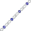Thumbnail Image 0 of 4.0mm Blue Lab-Created Sapphire and 0.15 CT. T.W. Diamond Infinity Twist Line Bracelet in Sterling Silver – 7.25"