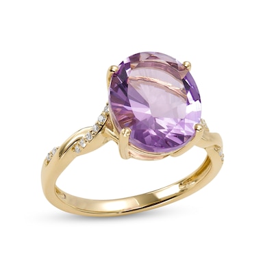 Oval Amethyst and 0.065 CT. T.W. Diamond Twist Shank Ring in 10K Gold