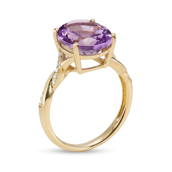 Oval Amethyst and 0.065 CT. T.W. Diamond Twist Shank Ring in 10K Gold