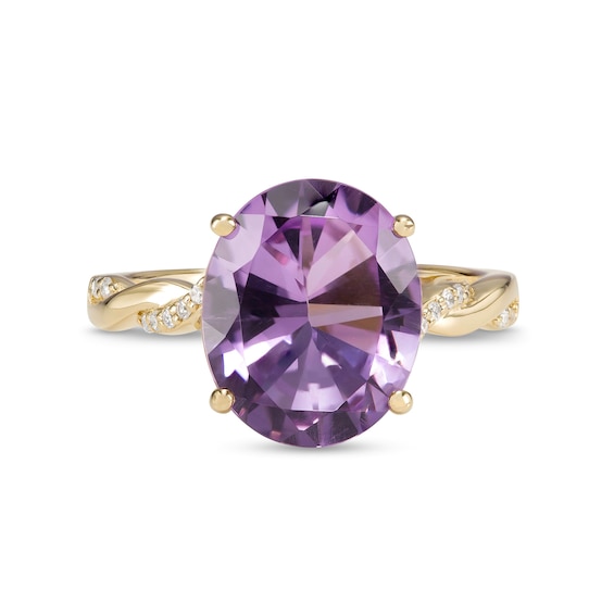 Oval Amethyst and 0.065 CT. T.W. Diamond Twist Shank Ring in 10K Gold