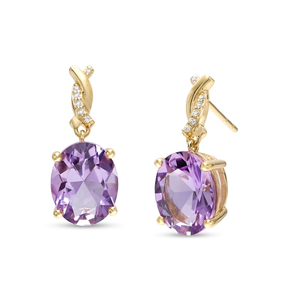 Oval Amethyst and 0.04 CT. T.W. Diamond Twist Drop Earrings in 10K Gold