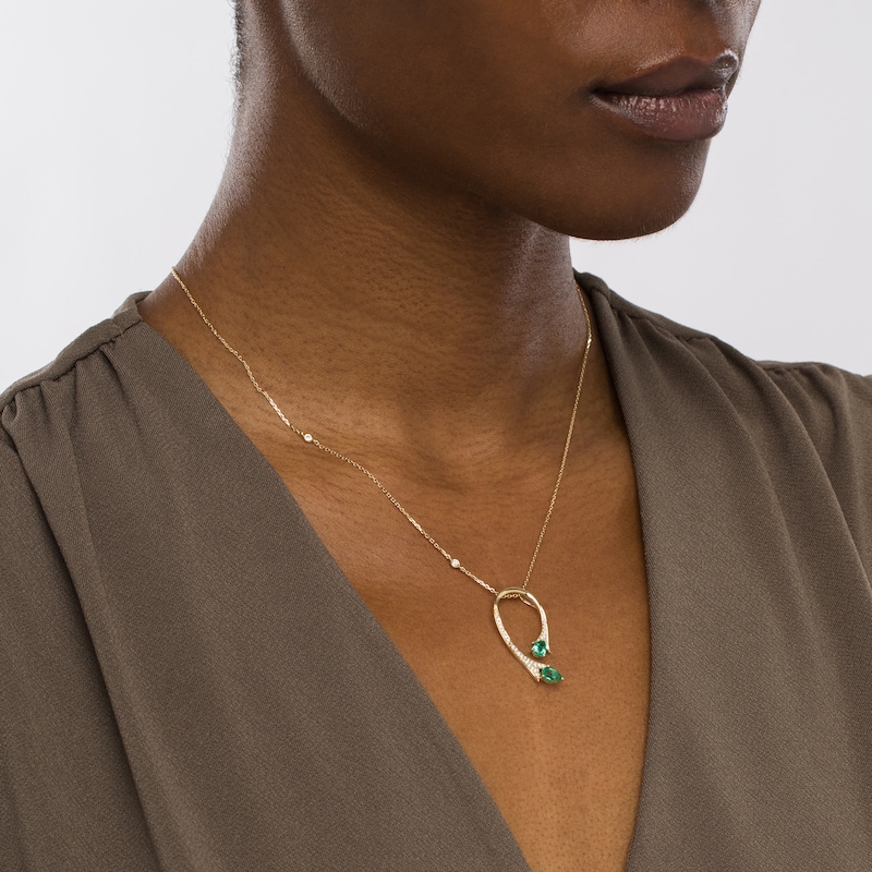 Pear-Shaped Emerald and 0.14 CT. T.W. Diamond Floral Loop Station Pendant in 10K Gold