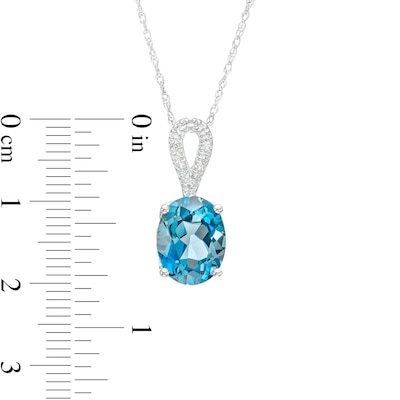 Oval London Blue Topaz and Diamond Accent Ribbon Loop Pendant in 10K White Gold