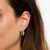 Thumbnail Image 1 of 17.0mm Diamond-Cut Intertwined Tube Hoop Earrings in 14K Gold with Rhodium Plate