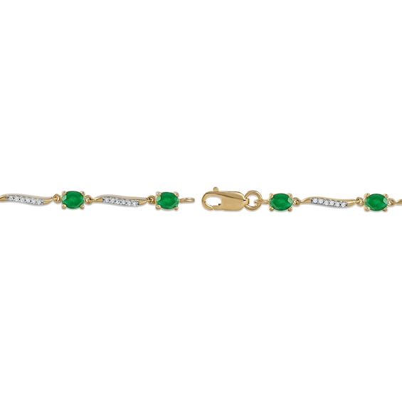 Oval Emerald and 0.16 CT. T.W. Diamond Wave Link Alternating Line Bracelet in 14K Gold – 7.25"