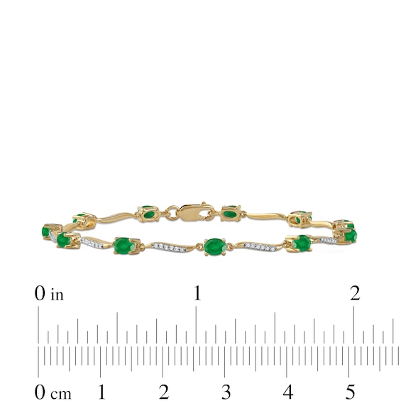 Oval Emerald and 0.16 CT. T.W. Diamond Wave Link Alternating Line Bracelet in 14K Gold – 7.25"