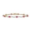 Oval Ruby and 0.16 CT. T.W. Diamond Wave Link Alternating Line Bracelet in 14K Gold - 7.25"