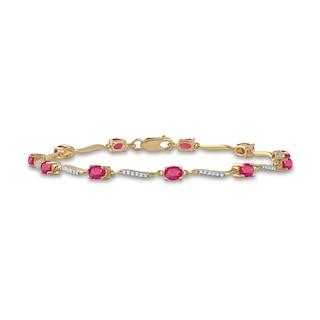 Oval Ruby and 0.16 CT. T.W. Diamond Wave Link Alternating Line Bracelet in 14K Gold - 7.25"