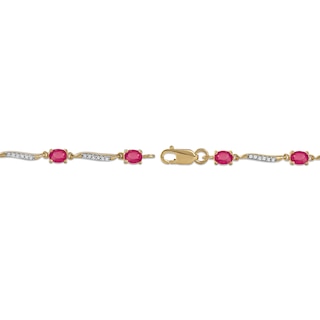 Oval Ruby and 0.16 CT. T.W. Diamond Wave Link Alternating Line Bracelet in 14K Gold - 7.25"