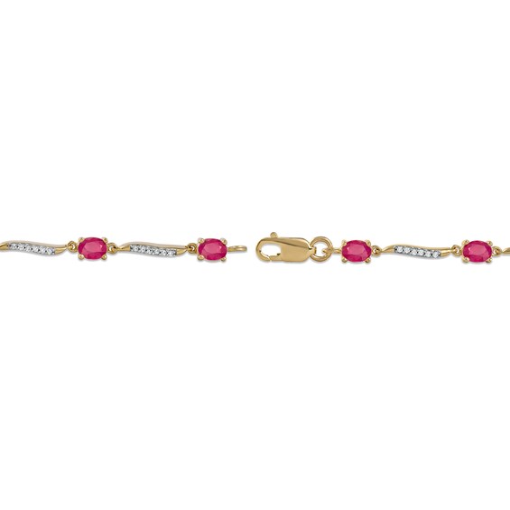 Oval Ruby and 0.16 CT. T.W. Diamond Wave Link Alternating Line Bracelet in 14K Gold - 7.25"