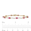 Oval Ruby and 0.16 CT. T.W. Diamond Wave Link Alternating Line Bracelet in 14K Gold - 7.25"