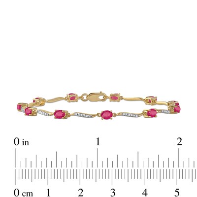 Oval Ruby and 0.16 CT. T.W. Diamond Wave Link Alternating Line Bracelet in 14K Gold - 7.25"