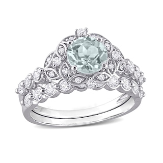 6.5mm Aquamarine, White Topaz and 0.06 CT. T.W. Diamond Flower Frame Bridal Set in 10K White Gold