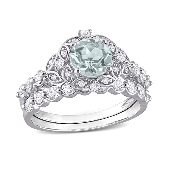 6.5mm Aquamarine, White Topaz and 0.06 CT. T.W. Diamond Flower Frame Bridal Set in 10K White Gold