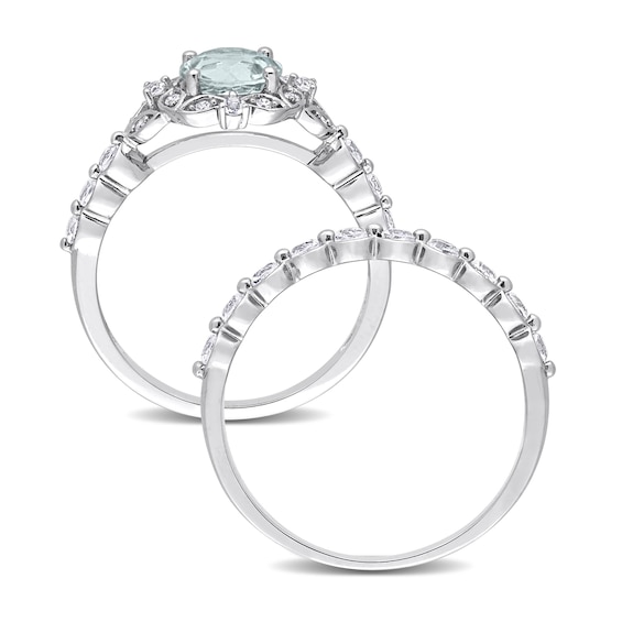 6.5mm Aquamarine, White Topaz and 0.06 CT. T.W. Diamond Flower Frame Bridal Set in 10K White Gold