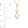 0.16 CT. T.W. Diamond Twist Flame Pendant in 10K Gold