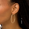 Thumbnail Image 1 of Italian Brilliance™ 45.0mm Diamond-Cut Glitter Tube Hoop Earrings in 14K Gold