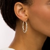 Thumbnail Image 1 of Italian Brilliance™ 30.0mm Diamond-Cut Twisted Tube Hoop Earrings in 14K Two-Tone Gold