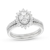 0.95 CT. T.W. Oval-Shaped Multi-Diamond Flower Frame Bridal Set in 10K Gold (J/I3