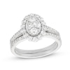 0.95 CT. T.W. Oval-Shaped Multi-Diamond Frame Bridal Set in 10K Gold (J/I3