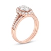 0.95 CT. T.W. Oval-Shaped Multi-Diamond Frame Bridal Set in 10K Rose Gold (J/I3)