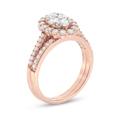 0.95 CT. T.W. Oval-Shaped Multi-Diamond Frame Bridal Set in 10K Rose Gold (J/I3)