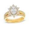 0.95 CT. T.W. Oval-Shaped Multi-Diamond Alternating Flower Frame Bridal Set in 10K Gold (J/I3)