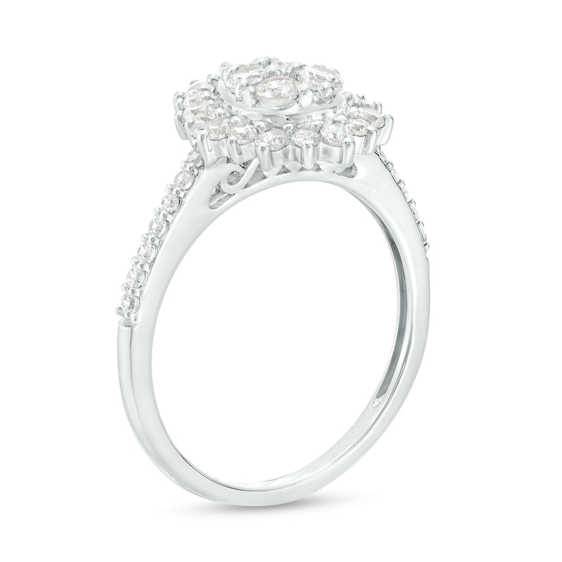 1.115 CT. T.W. Pear-Shaped Multi-Diamond Flower Frame Three Piece Bridal Set in 10K White Gold (J/I3)