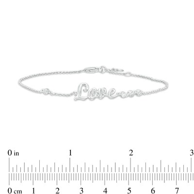 0.04 CT. T.W. Diamond Cursive Script "Love" Bracelet in Sterling Silver – 7.5"