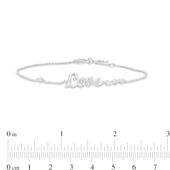 0.04 CT. T.W. Diamond Cursive Script "Love" Bracelet in Sterling Silver – 7.5"