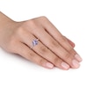 Thumbnail Image 1 of 8.0mm Trillion-Cut Tanzanite and 0.12 CT. T.W. Diamond Ribbon Ring in Sterling Silver