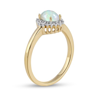 Oval Opal and 0.115 CT. T.W. Baguette and Round Diamond Starburst Frame Ring in 10K Gold