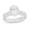 1.70 CT. T.W. Certified Oval Lab-Created Diamond Frame Bridal Set in 14K White Gold (F/SI2)