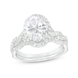 2.60 CT. T.W. Certified Oval Lab-Created Diamond Frame Twist Shank Bridal Set in 14K White Gold (F/SI2)