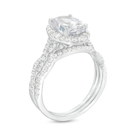 2.60 CT. T.W. Certified Oval Lab-Created Diamond Frame Twist Shank Bridal Set in 14K White Gold (F/SI2)