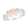 Thumbnail Image 0 of 0.115 CT. T.W. Diamond Interlocking Hearts Split Shank Promise Ring in Sterling Silver and 14K Rose Gold Plate