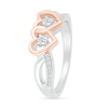 Thumbnail Image 1 of 0.115 CT. T.W. Diamond Interlocking Hearts Split Shank Promise Ring in Sterling Silver and 14K Rose Gold Plate